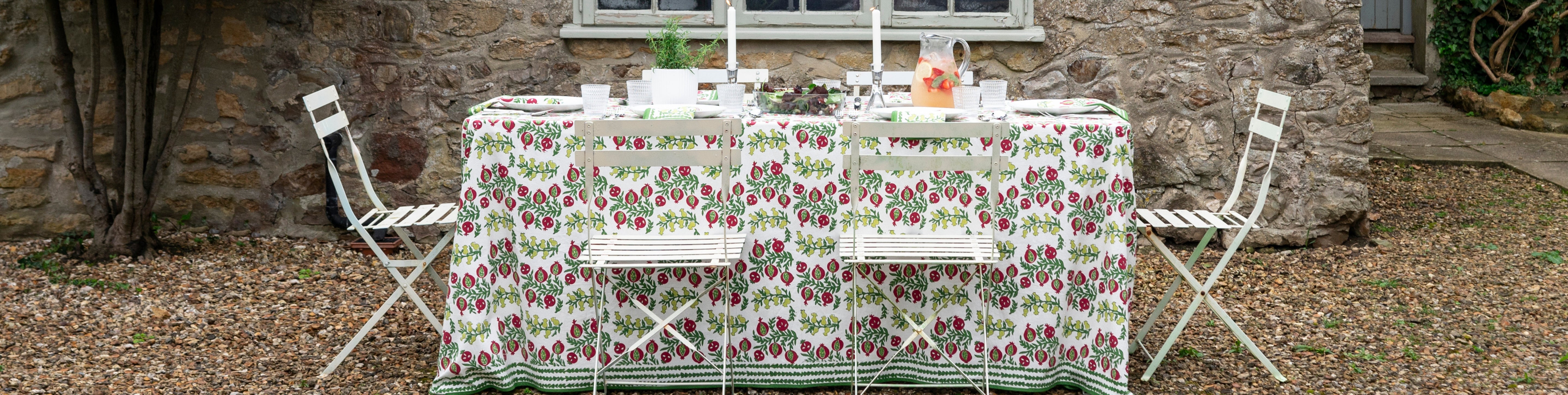 spice route garnet napkins on white plate