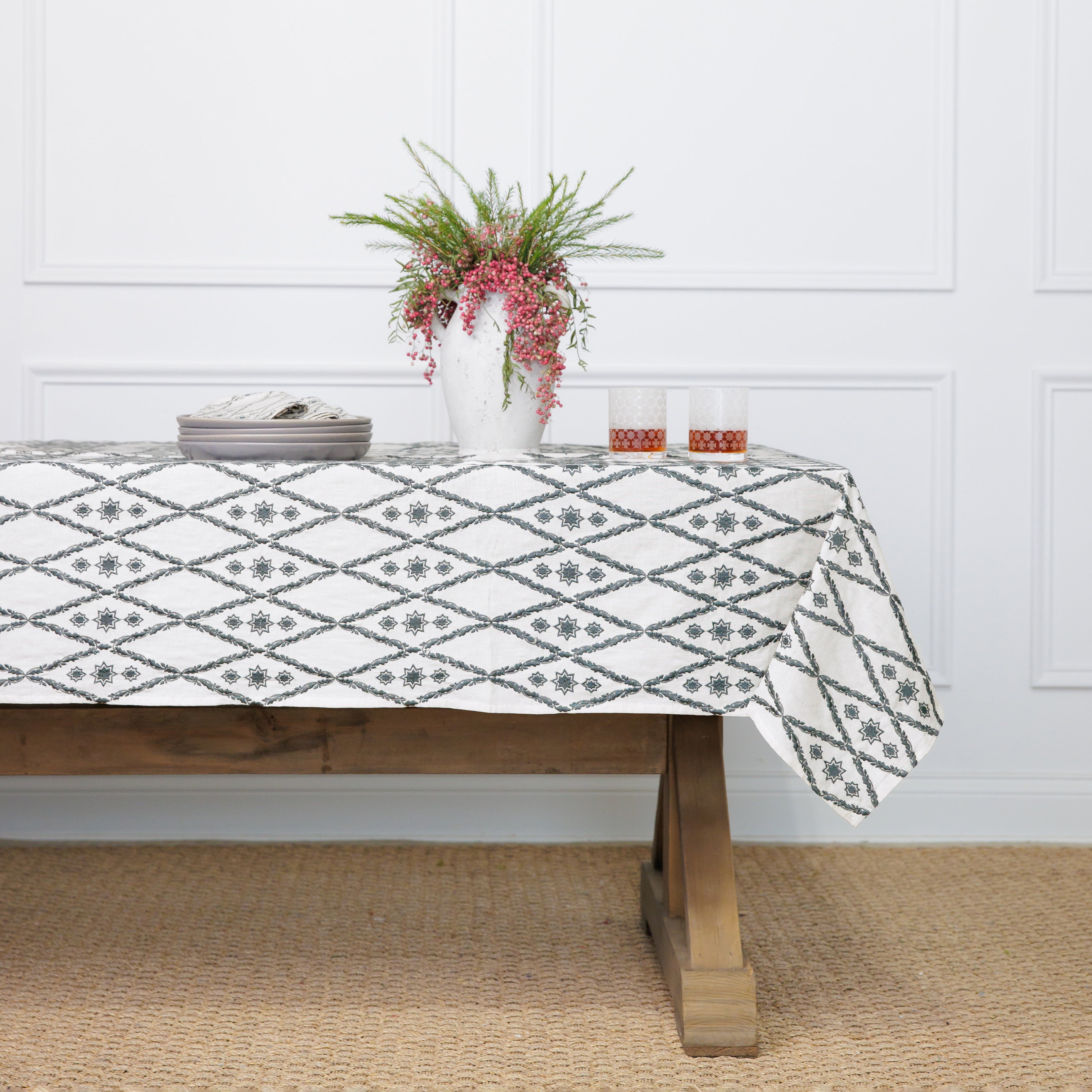 A table setting featuring a geometric patterned tablecloth