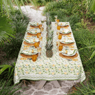 Dining table set with pineapple-themed decor outdoors