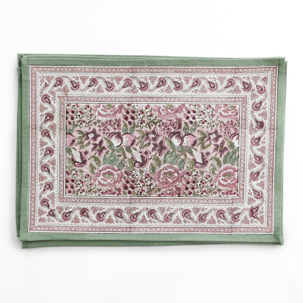 Set of floral patterned placemats on a white background