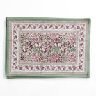 Set of floral patterned placemats on a white background