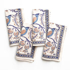 Set of four decorative towels with bird and floral patterns on a white background