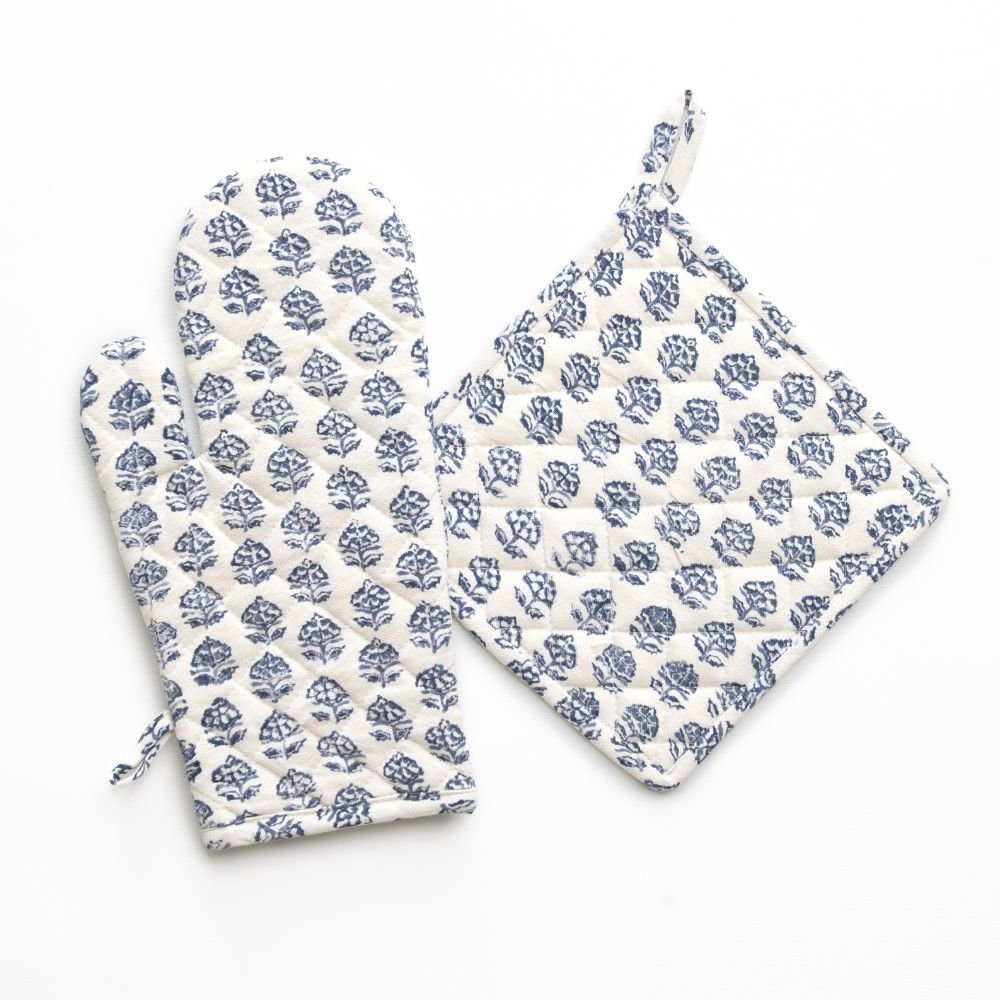 Set of blue floral-patterned oven mitt and pot holder on a white background