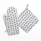 Set of blue floral-patterned oven mitt and pot holder on a white background