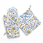 Floral-patterned oven mitt and pot holder set on a white background
