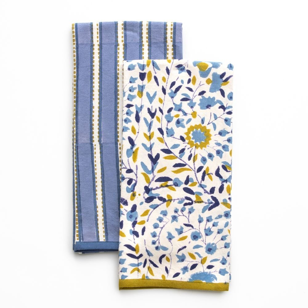Two kitchen towels, one with blue stripes and the other with a floral pattern, on a white background.