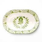 Decorative platter with green floral design on a white background