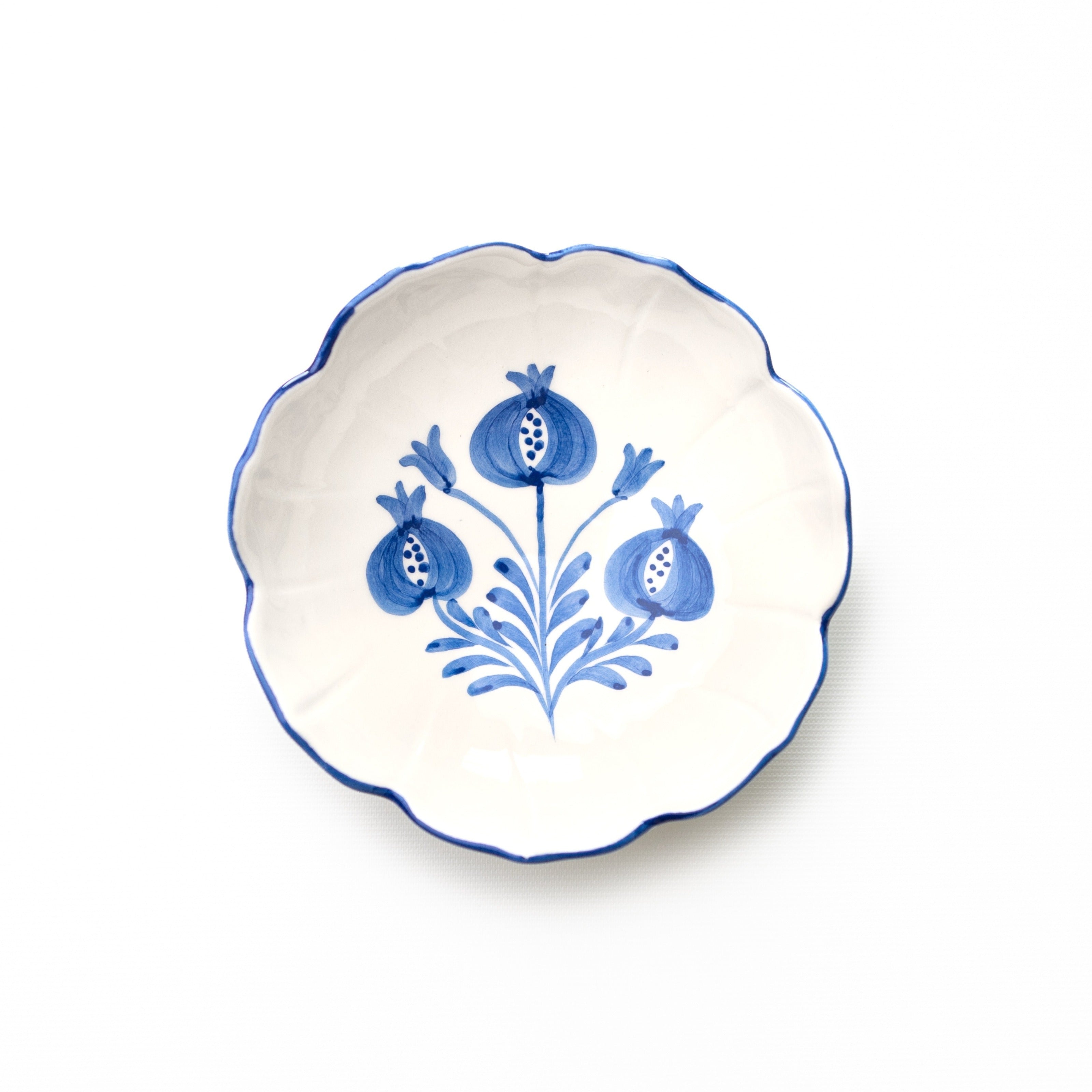 Decorative bowl with cobalt blue floral design on a white background