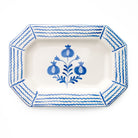 Decorative platter with blue floral design and wavy border on a white background
