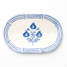 Oval ceramic platter with blue floral design on a white background