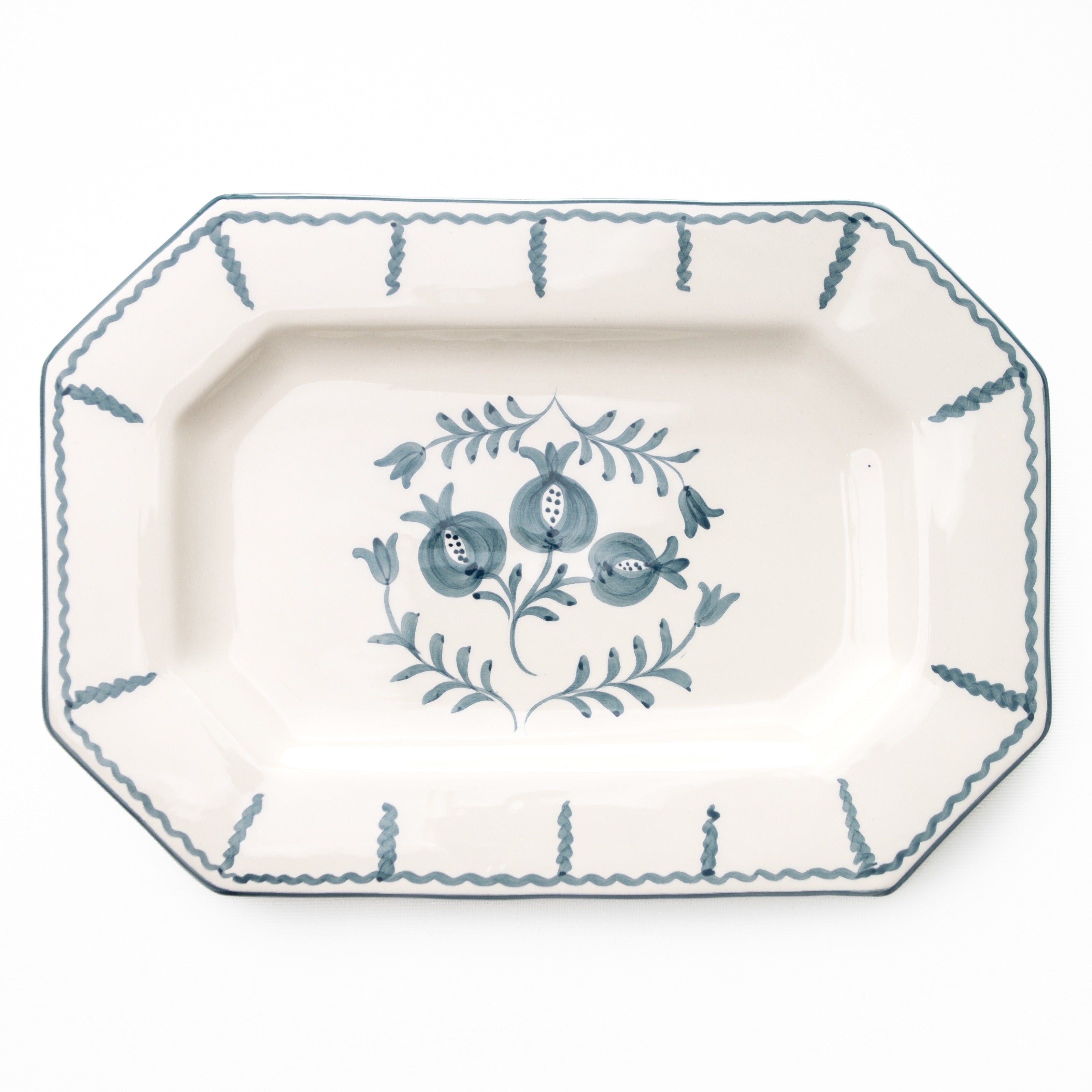 Decorative platter with blue floral design on a white background