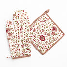 Floral-patterned pot holder and trivet on a white background