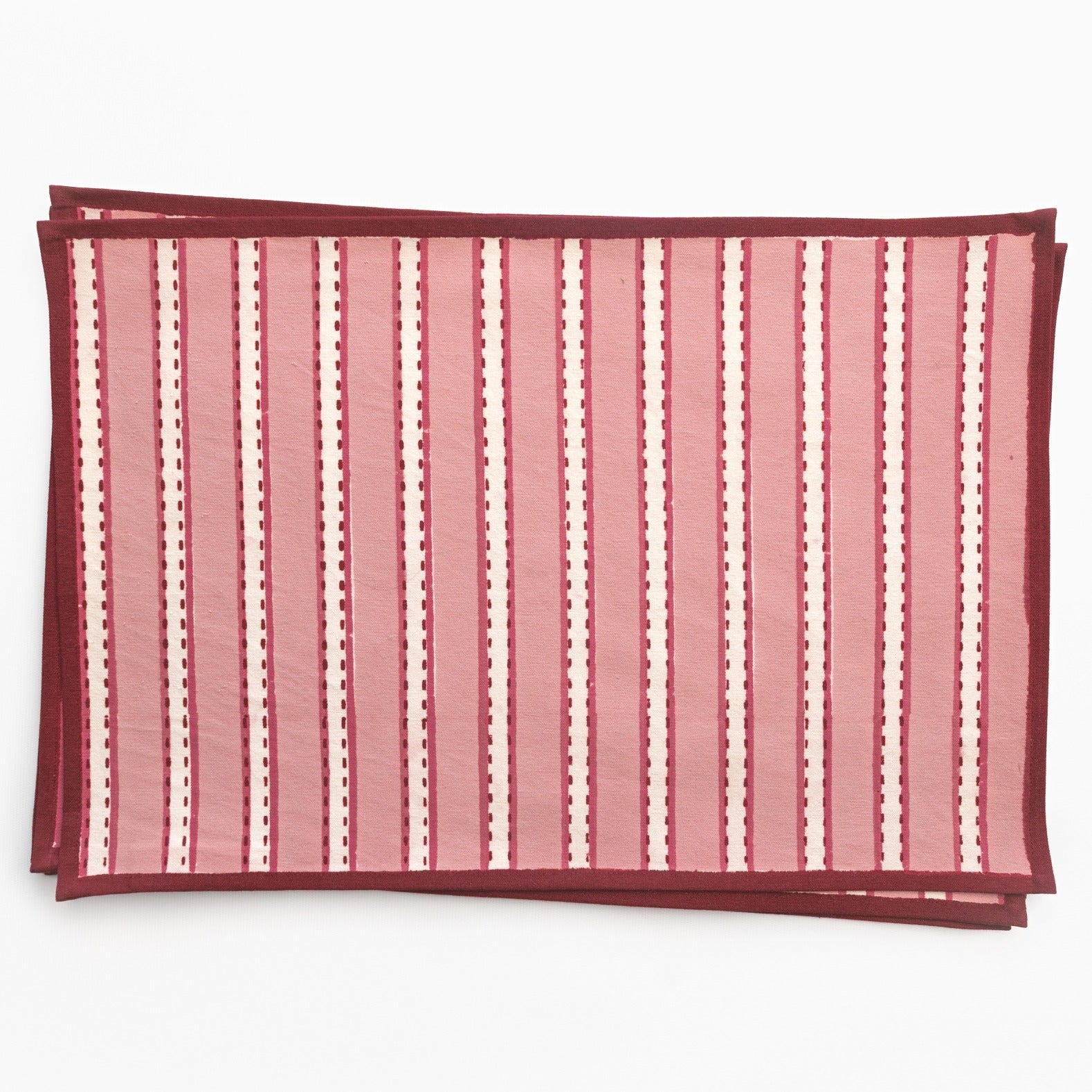 Rose and white striped fabric on a white background