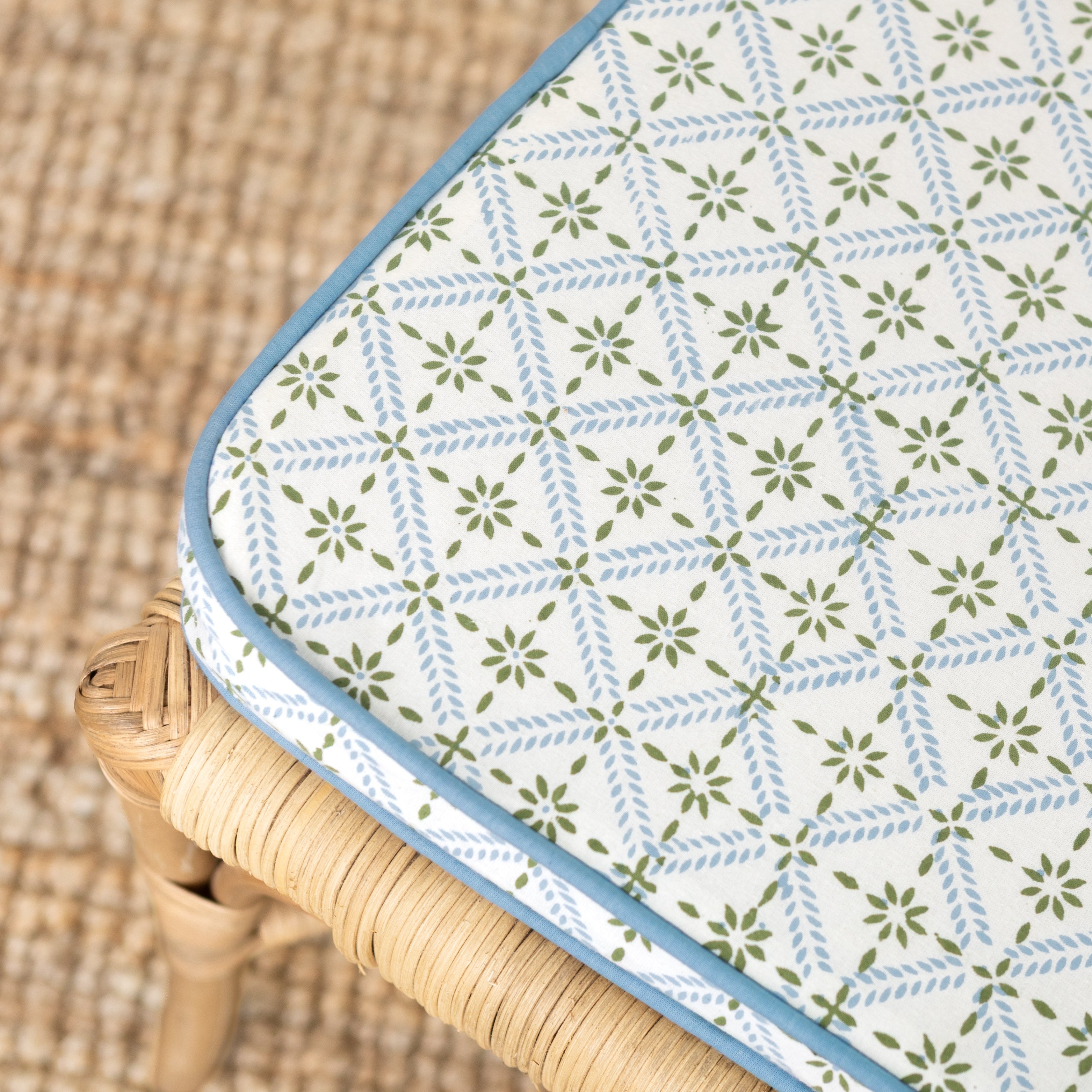 Patterned fabric cover on a wicker chair