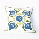 Decorative pillow with blue and green floral pattern on a white background