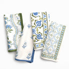 Set of four patterned napkins on a white background