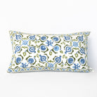 Decorative pillow with blue and green floral pattern on a white background