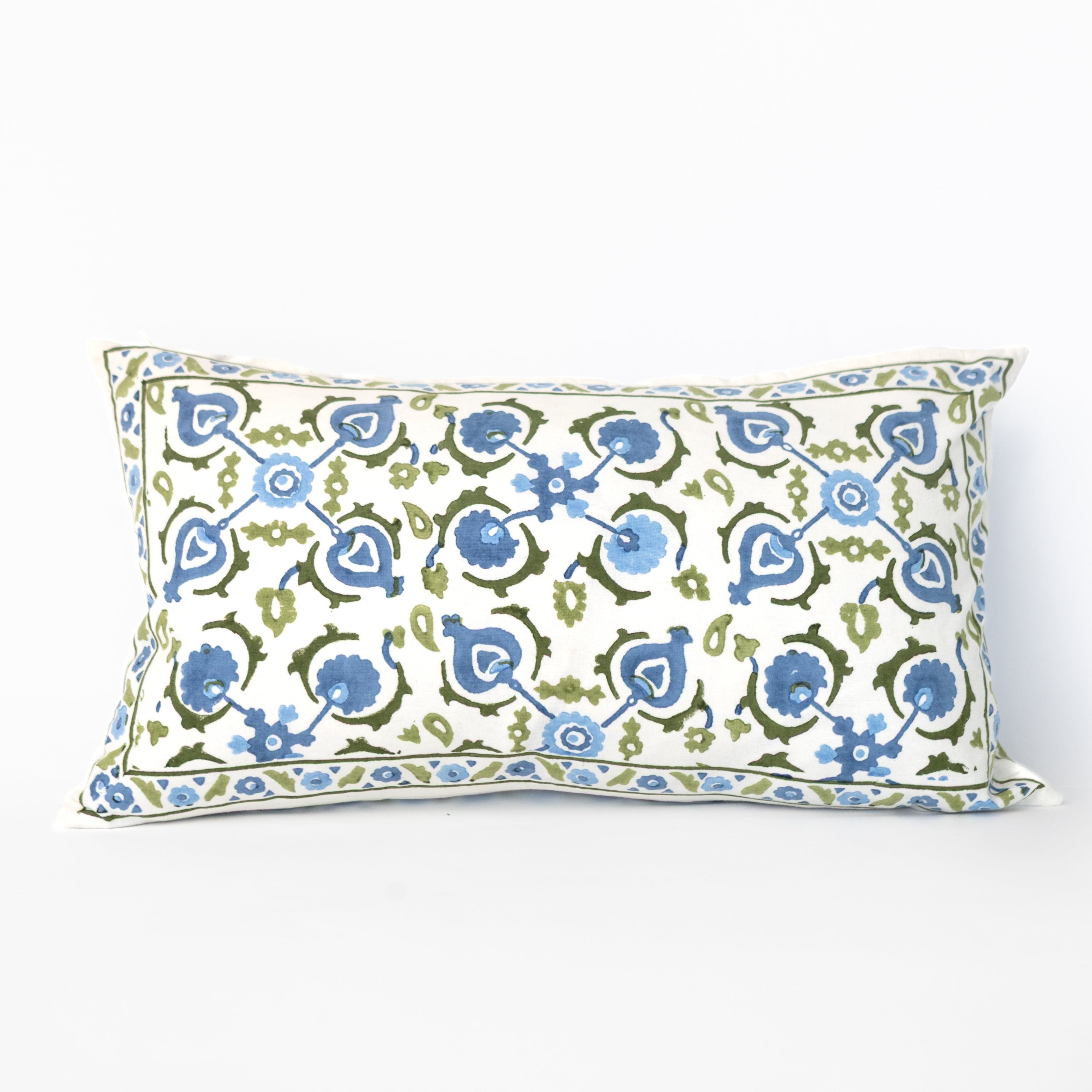 Decorative pillow with blue and green floral pattern on a white background