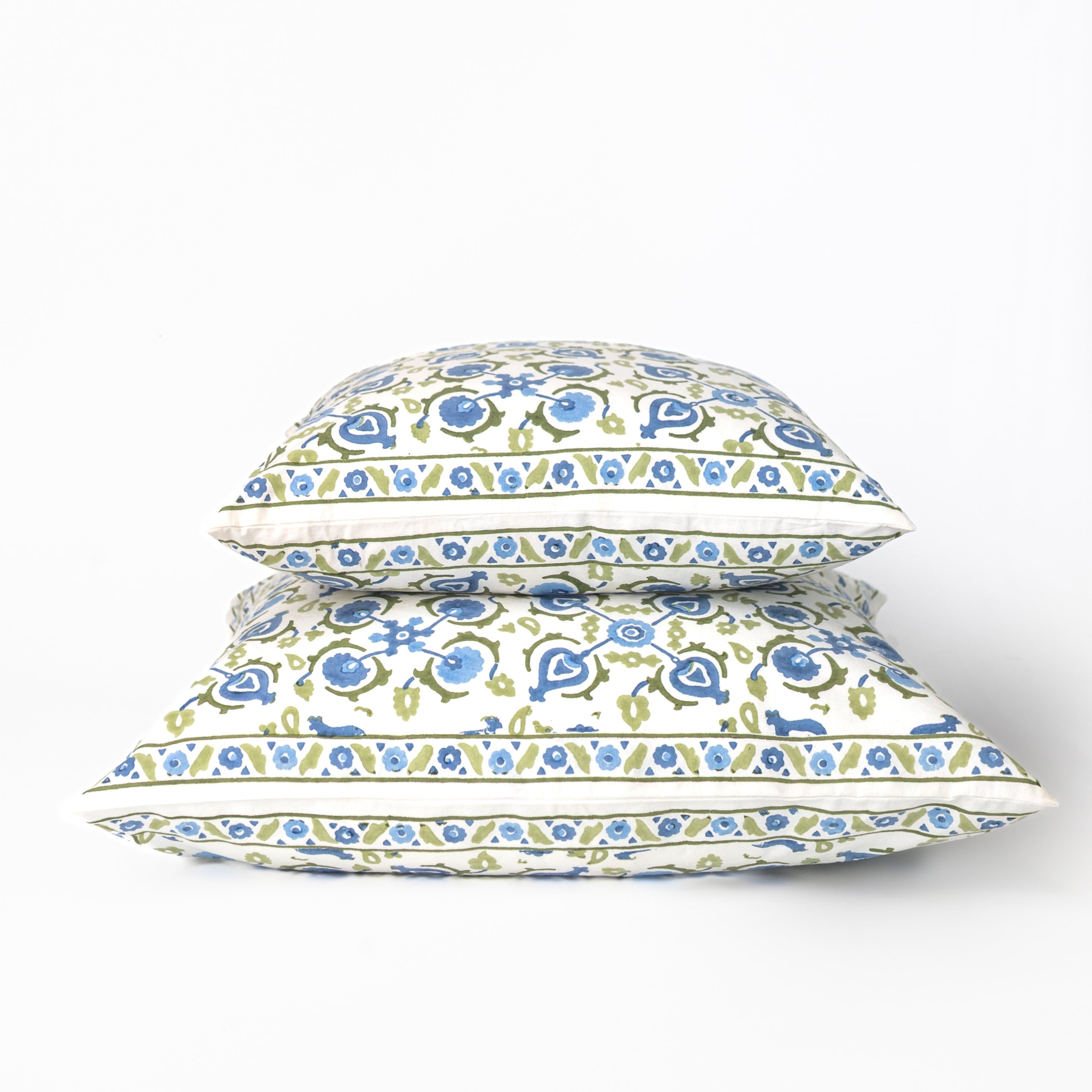Floral patterned pillows on a white background