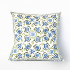 Decorative pillow with blue and green floral pattern on a white background