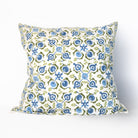 Decorative pillow with blue and green floral pattern on a white background