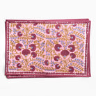 Pink placemat with floral pattern on a white background
