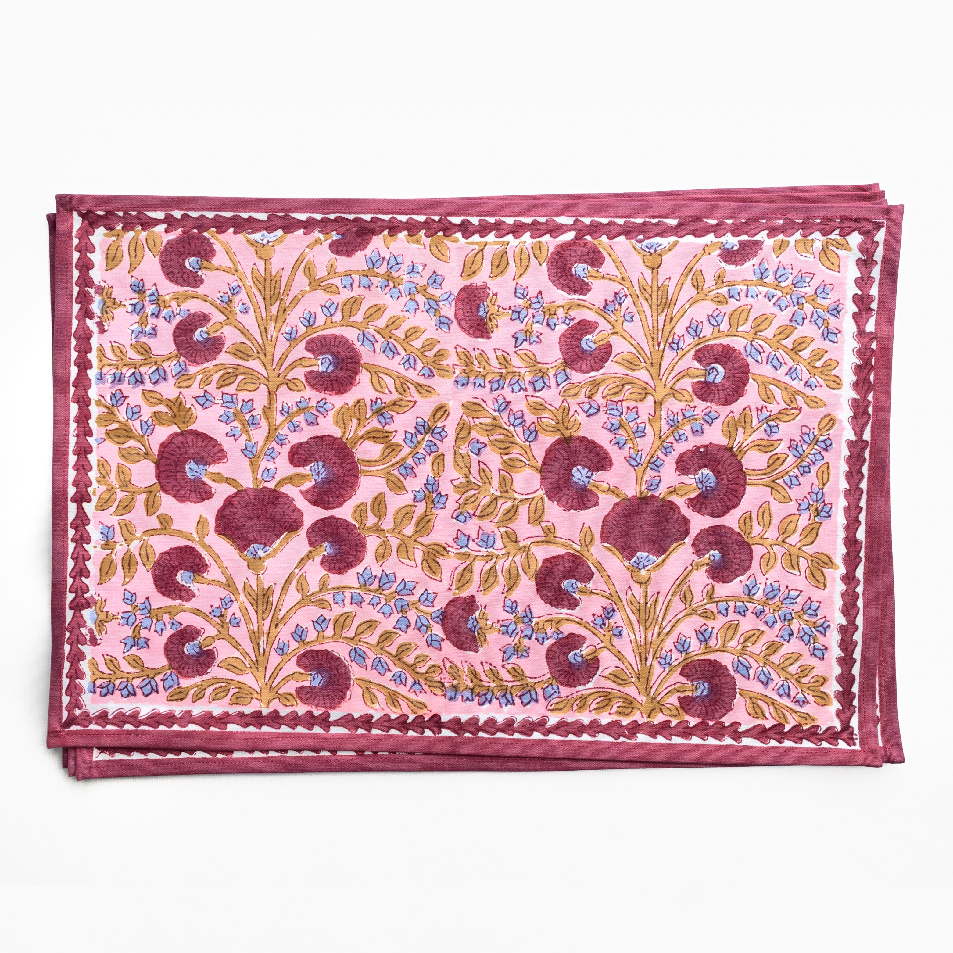 Pink placemat with floral pattern on a white background