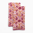 Two pink floral patterned napkins on a white background