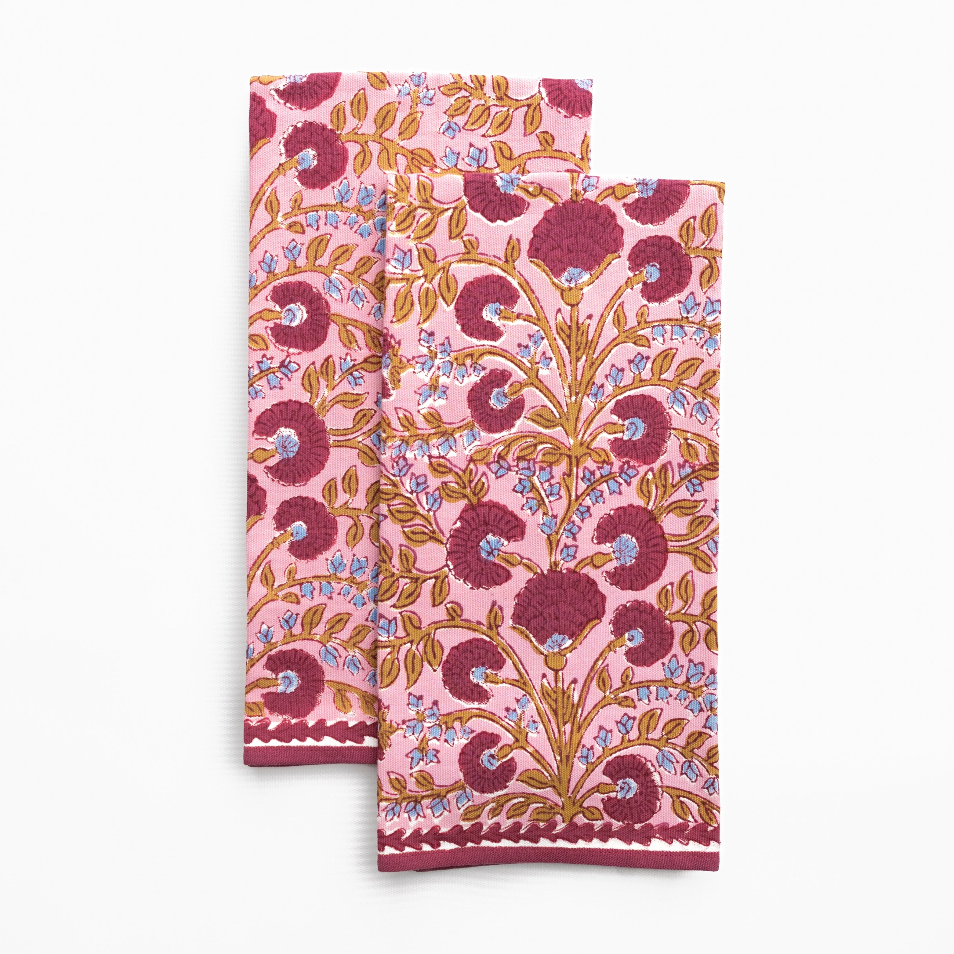 Two pink floral patterned napkins on a white background