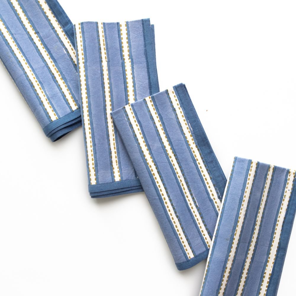 Set of blue striped napkins on a white background