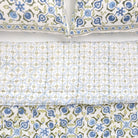 Set of patterned bed sheets and pillowcases on a white background