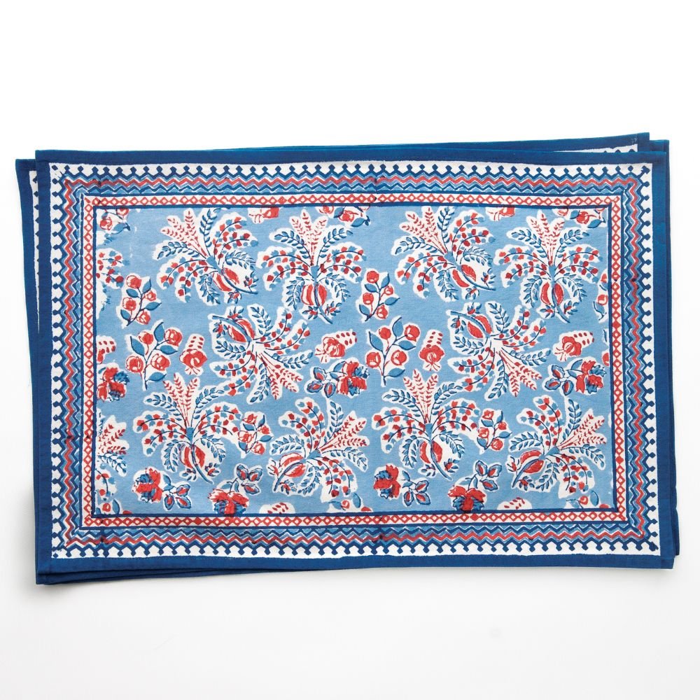 Blue and red patterned placemats on a white background