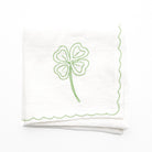 White linen cocktail napkins embroidered with green 4 leaf clover design