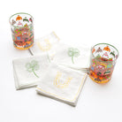 White linen cocktail napkins embroidered with green 4 leaf clover and lucky horse shoe designs