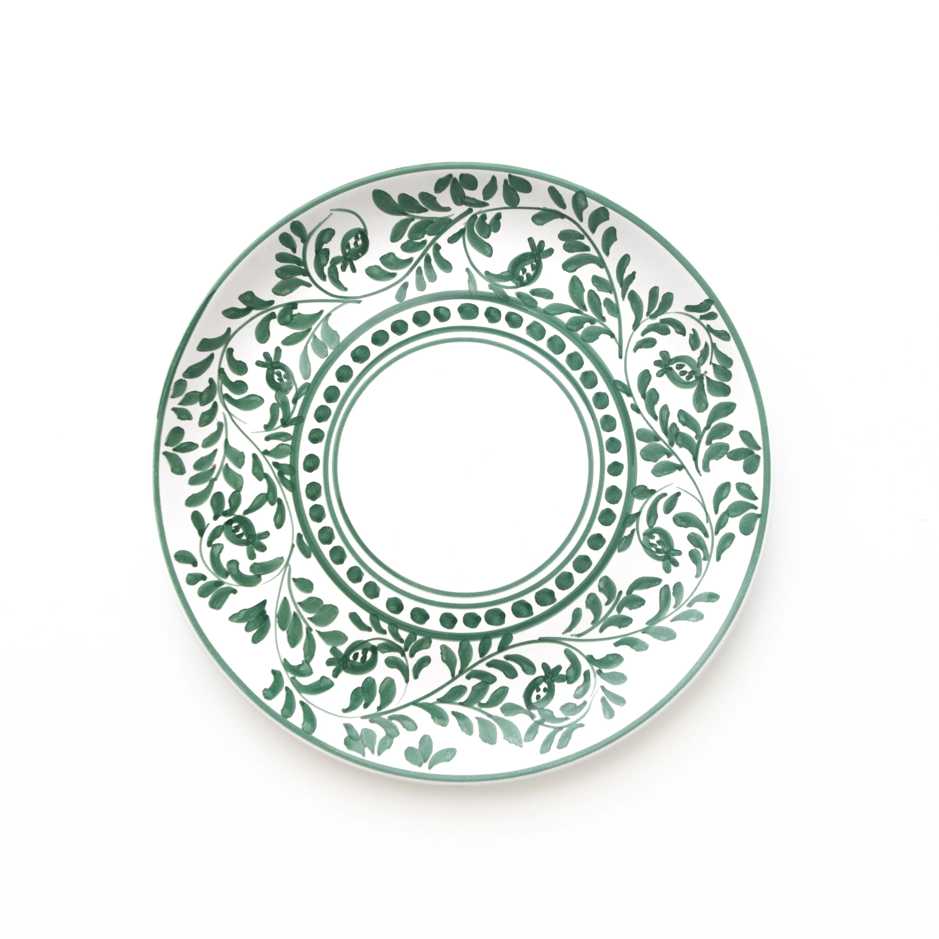 Decorative plate with green leaf pattern on a white background