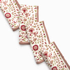 Set of floral-patterned napkins on a white background