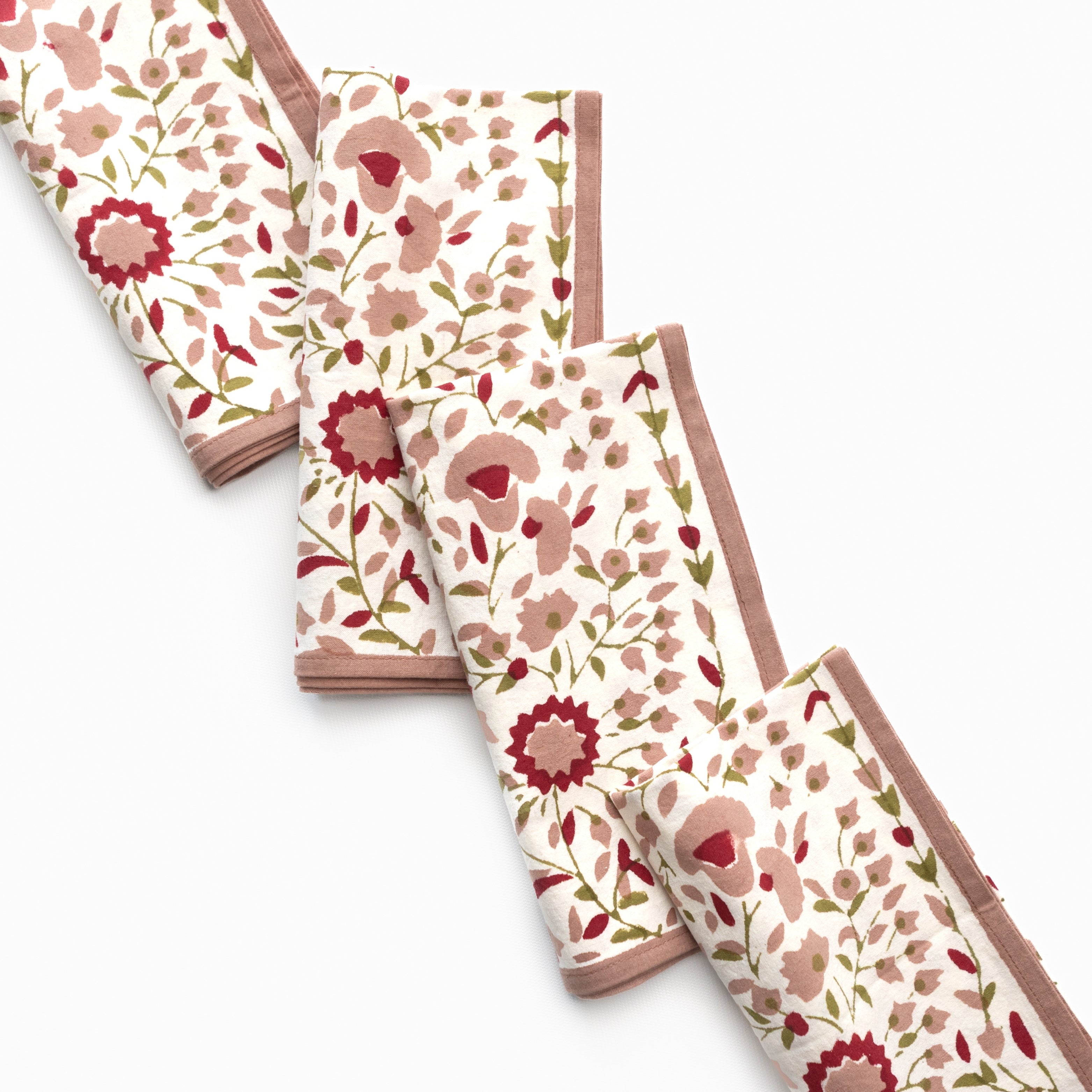 Set of floral-patterned napkins on a white background
