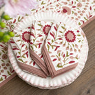 Floral-patterned napkins on a wooden surface