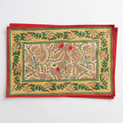 A set of four Winter Pinecone Placemats with a festive pine cone and leaf design in red, green, and gold colors on a cotton fabric.