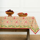 A rectangular tablecloth with a pinecone and foliage pattern, displayed on a table with a white background