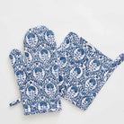 Warm blue hues paired with solid white to give a modern yet global look to this oven mitt set.
