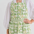 Spring Ginkgo apron with adjustable ties and pockets.