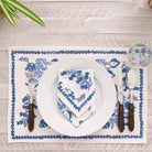 Placemat and napkin folded on a plate.