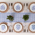 Table runner paired with matching napkins decorating dinner table.