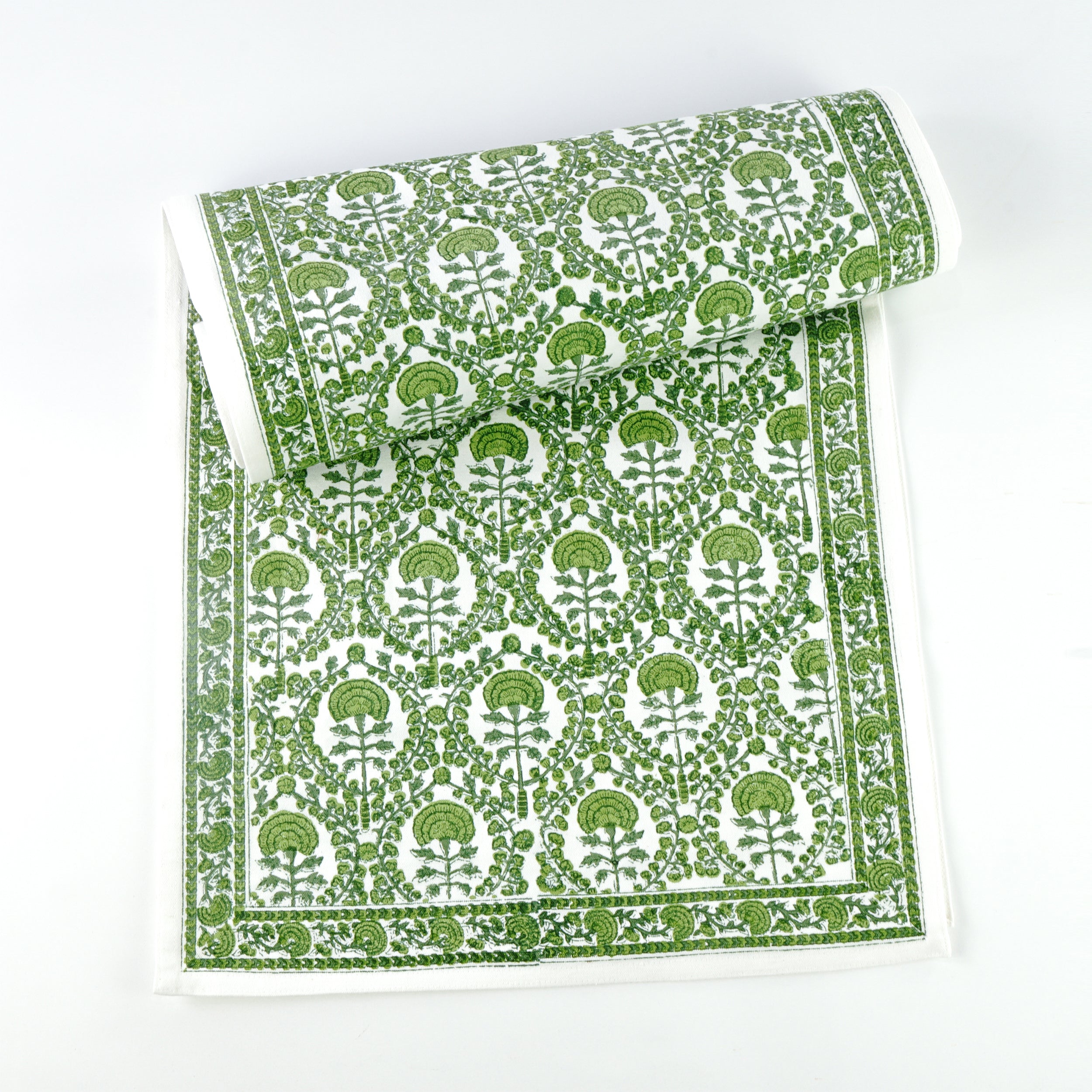 This 100% cotton table runner is a beautiful staple to have in your home and consists of rich and intricate green and white floral details.