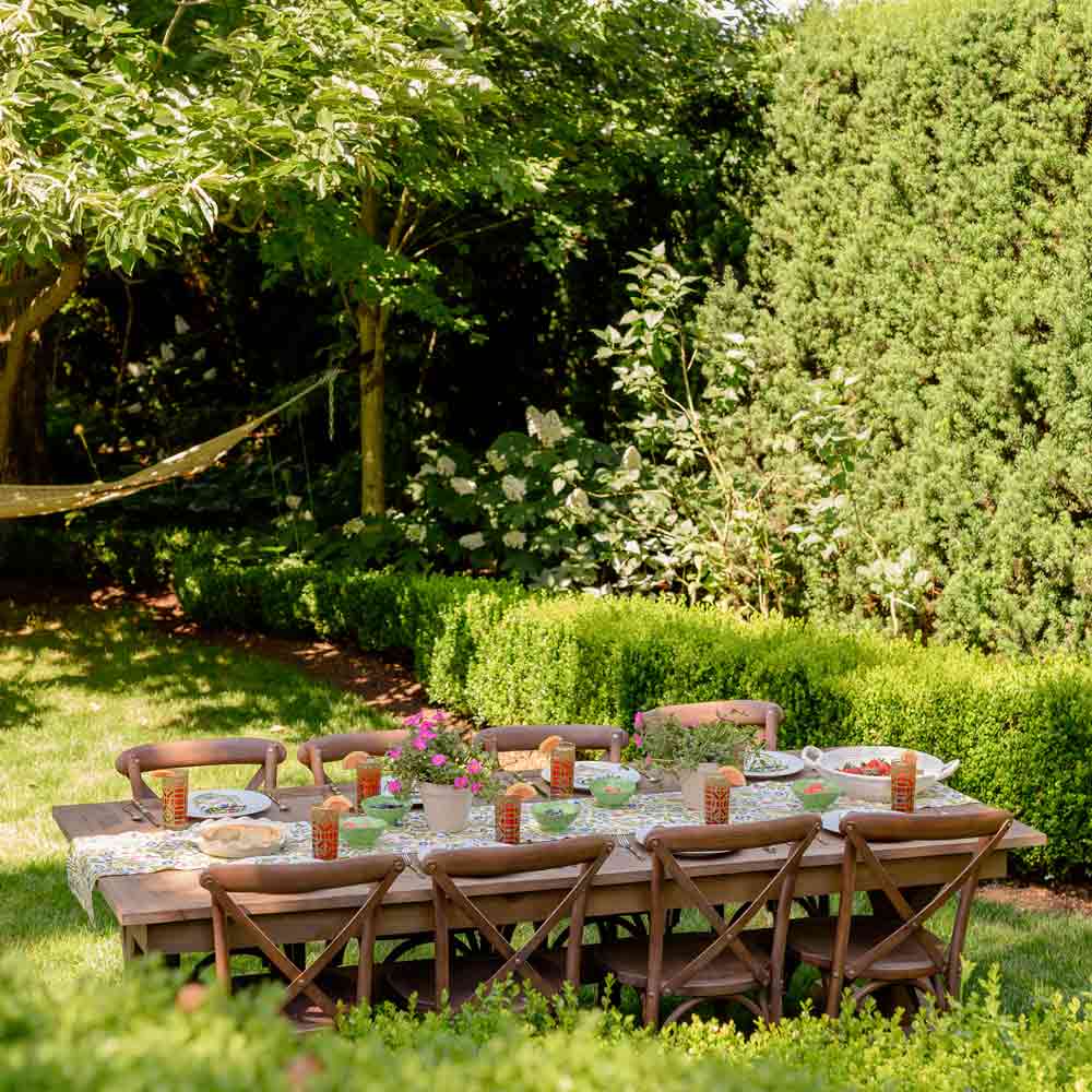 A table set for dinner in a garden setting