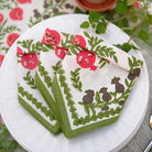 Folded napkins on white plates.