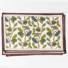 Close up of rich green and deep chocolate brown maple leaf and acorn print.