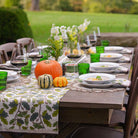 Maple & Acorn table runner with pumpkin decor.