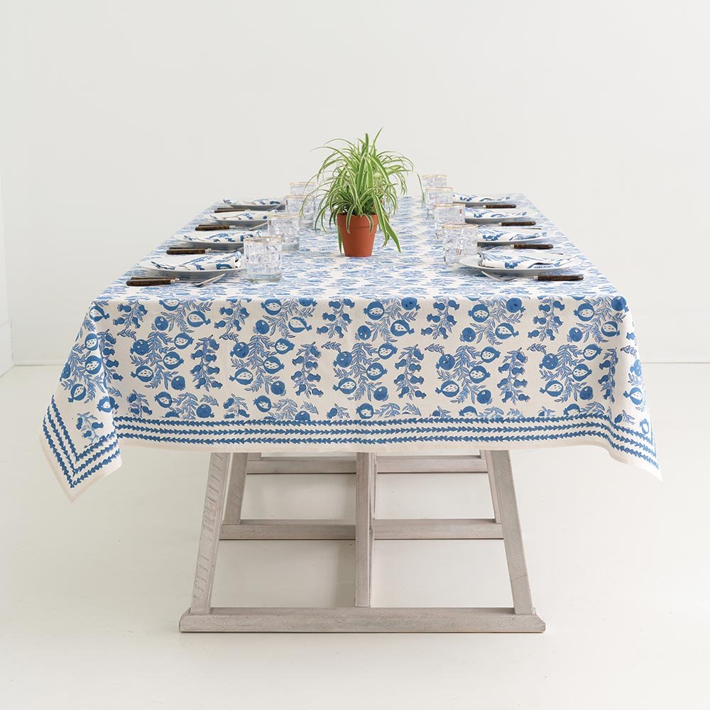 Indoor table with Pom Bells Wedgewood tablecloth.